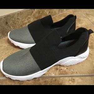 Black and gray mesh slip on sneakers.